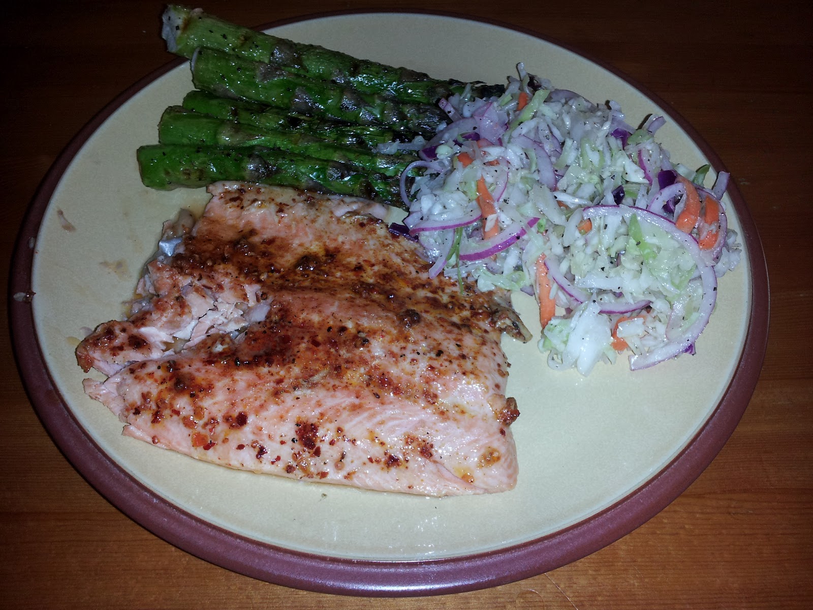 Poonapalooza Cajun rainbow trout with grilled asparagus and coleslaw