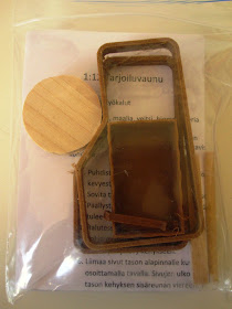 Small ziplock bag containing pieces of wood and a folded instruction sheet