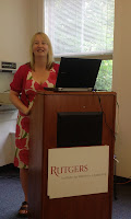 Nancy standing at a lectern