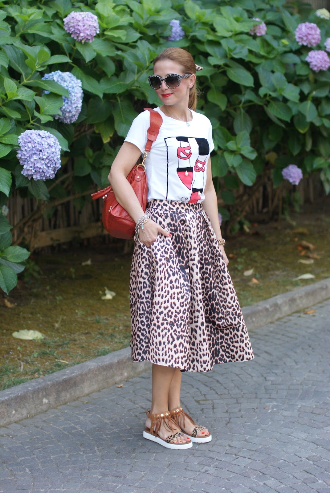 Leopard print is the new neutral with Dolce & Gabbana leopard sunglasses found on Giarre.com, leopard print midi skirt on Fashion and Cookies fashion blog, fashion blogger style
