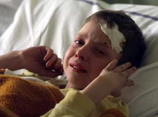 An injured Serb boy, Marko Miladinovic, cries in his hospital bed in Aleksinac (AP Photo/Srdjan Ilic)