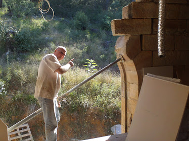 Marty helping to refix stone block in kitchen windowusing Acrow prop and Chemset anchors