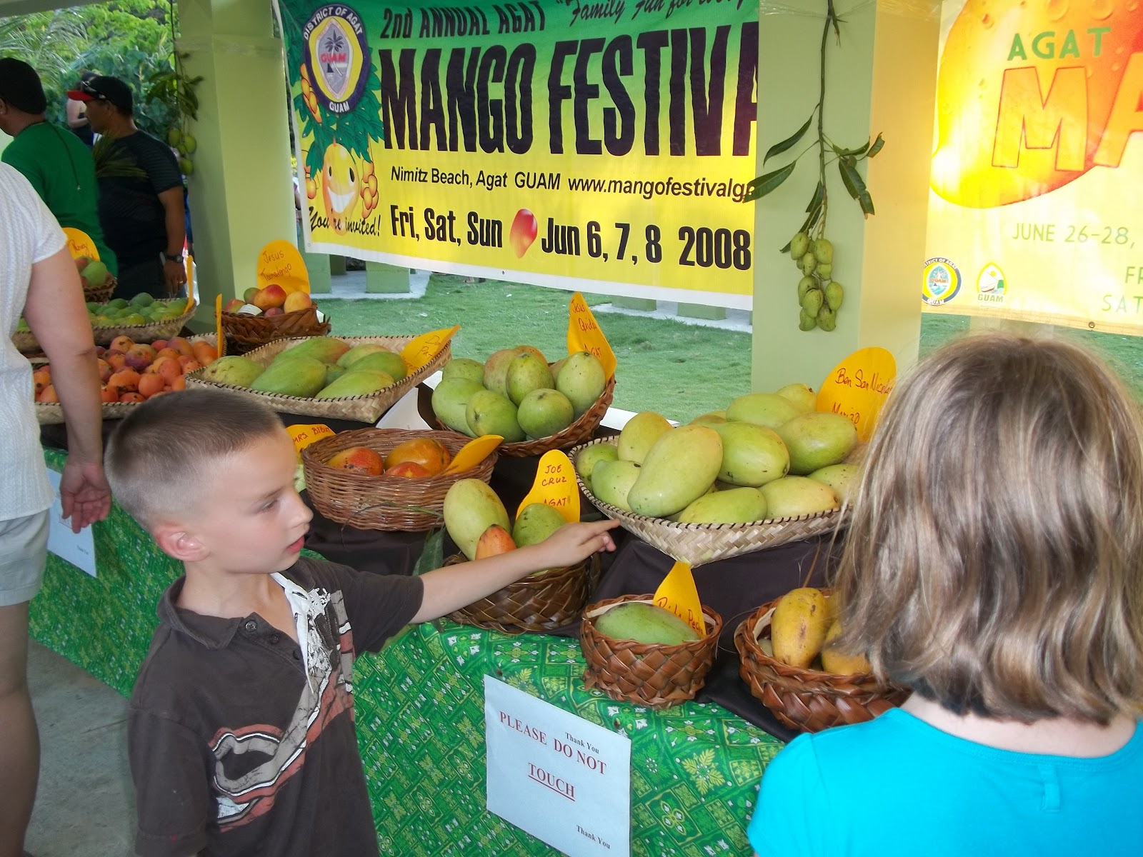tipping guam over Agat Mango Festival