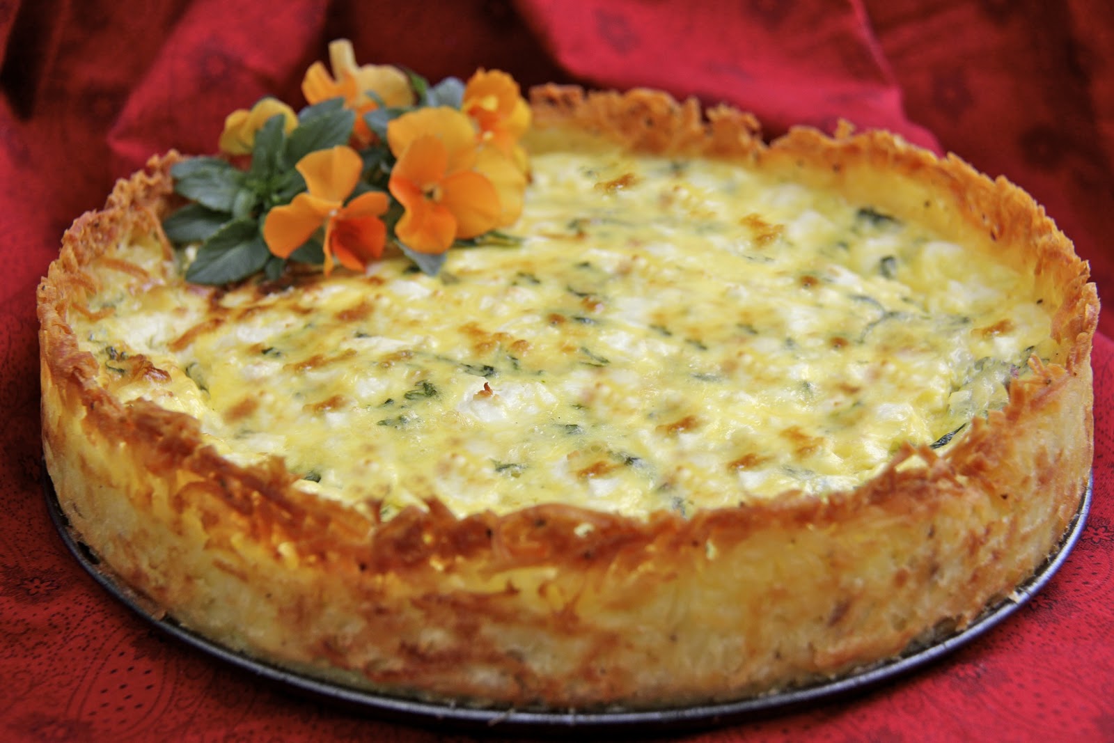 Goat Cheese, Fontina & Arugula Quiche w/ Crispy Hash Brown Crust The