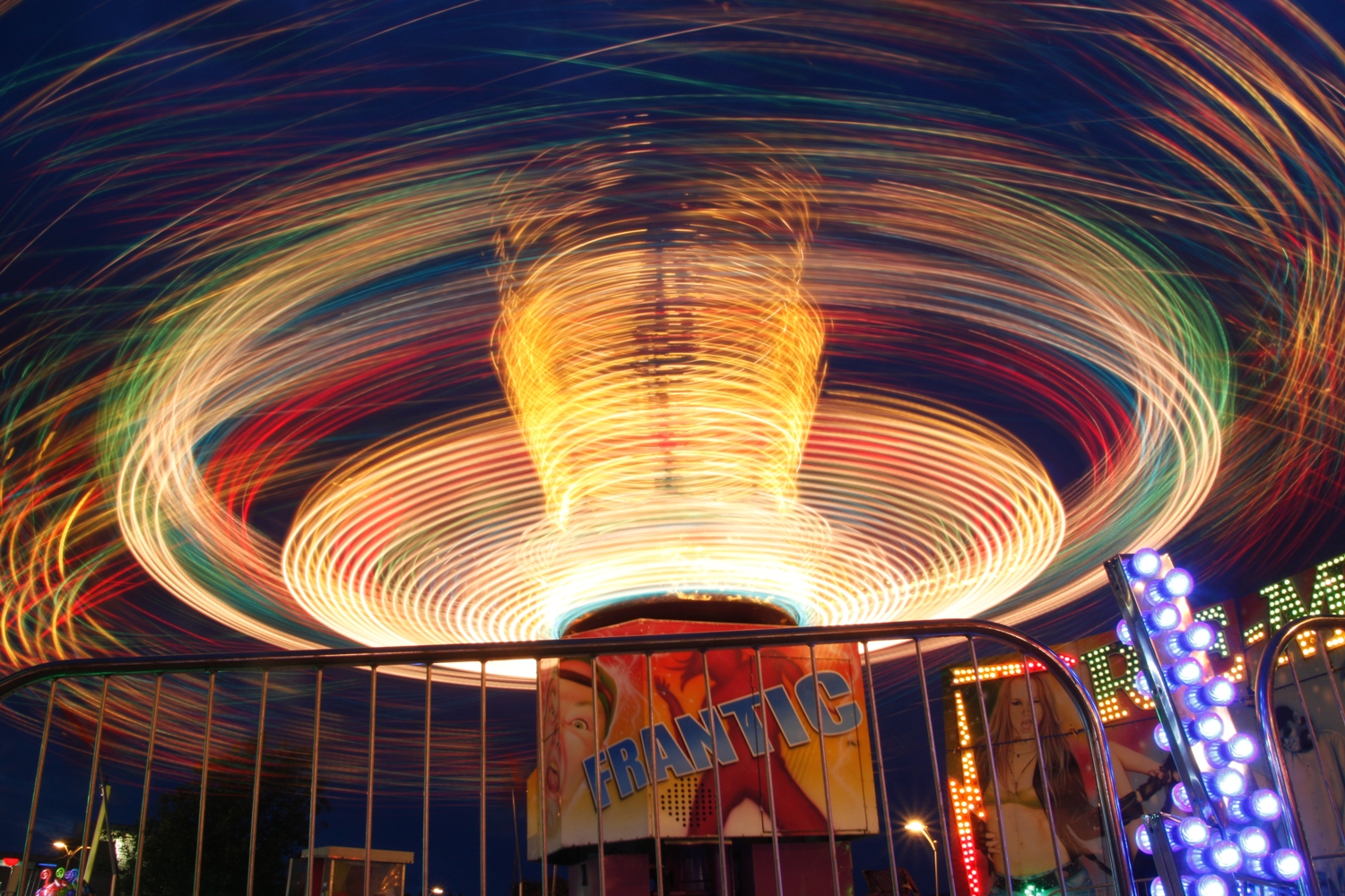 Long exposure carnival ride during blue hour