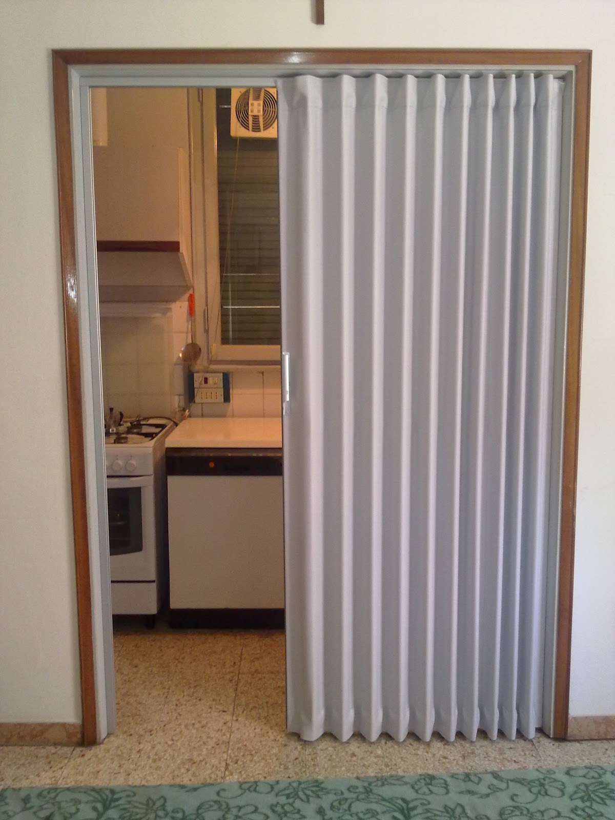 accordion doors: Folding Doors Separating Kitchen from Lounge