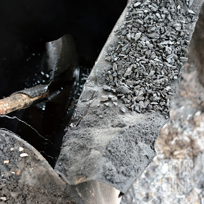 A shovel in a barrel of tar along the road to Taunggyi, Myanmar.