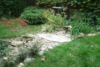 dry stream bed downspout disconnection project by Paul Jung Gardening Services Toronto