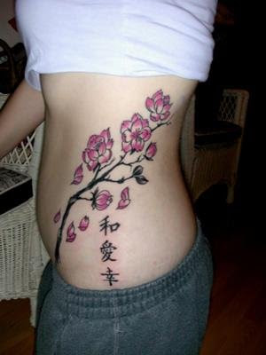 cheery blossom rib tattoo Tattoos On Rib Cage For Girls