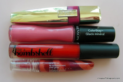 L'Oreal Colour Caresse Wet Shine Stain in Infinite Fuschia ($10) vs. Revlon ColorStay Mineral Lipgloss in Perennial Pink ($8) vs. Be a Bombshell Lip Gloss in Hot Mess ($14) vs. Avon Lip Radiance Mini Swirl Gloss in a discontinued shade ($2)
