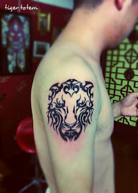 totem tiger tattoo on the arm