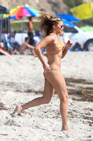 LeAnn Rimes running on the beach in LA in a hot bikini