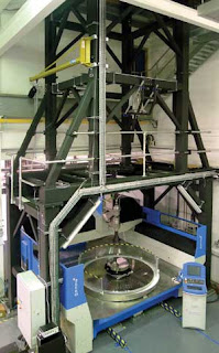 PhaseCam in a tower measuring a mirror blank in the polishing station below