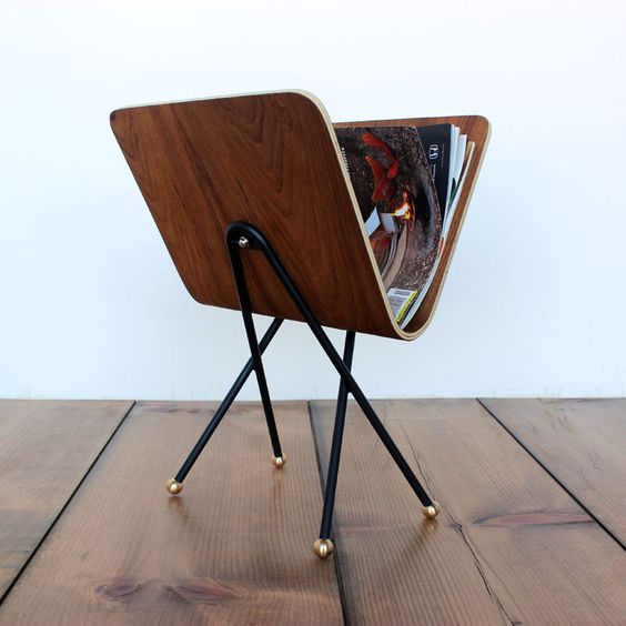 http://shop.onefortythree.com/products/molded-plywood-magazine-rack
