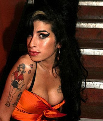 According to E Online Amy Winehouse was tragically found dead in her 