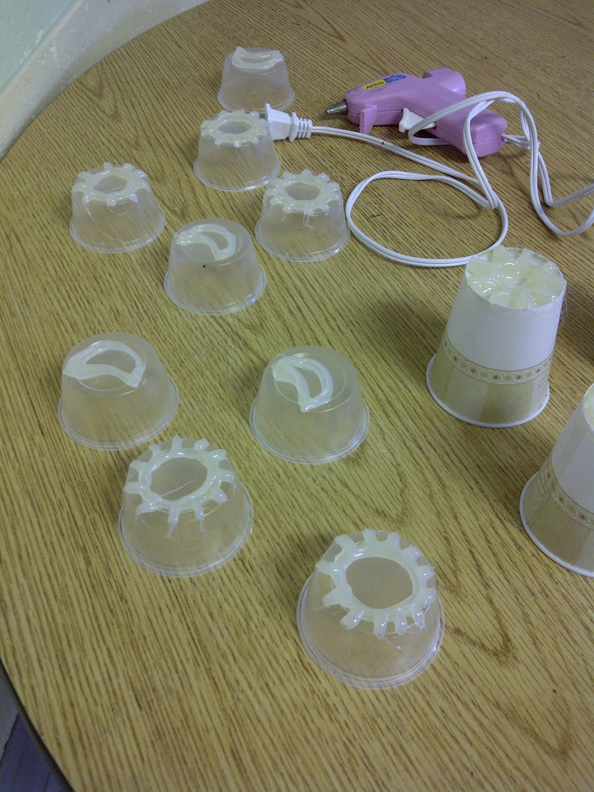 Pieces of String Stamps Using Plastic Cups and a Glue Gun.