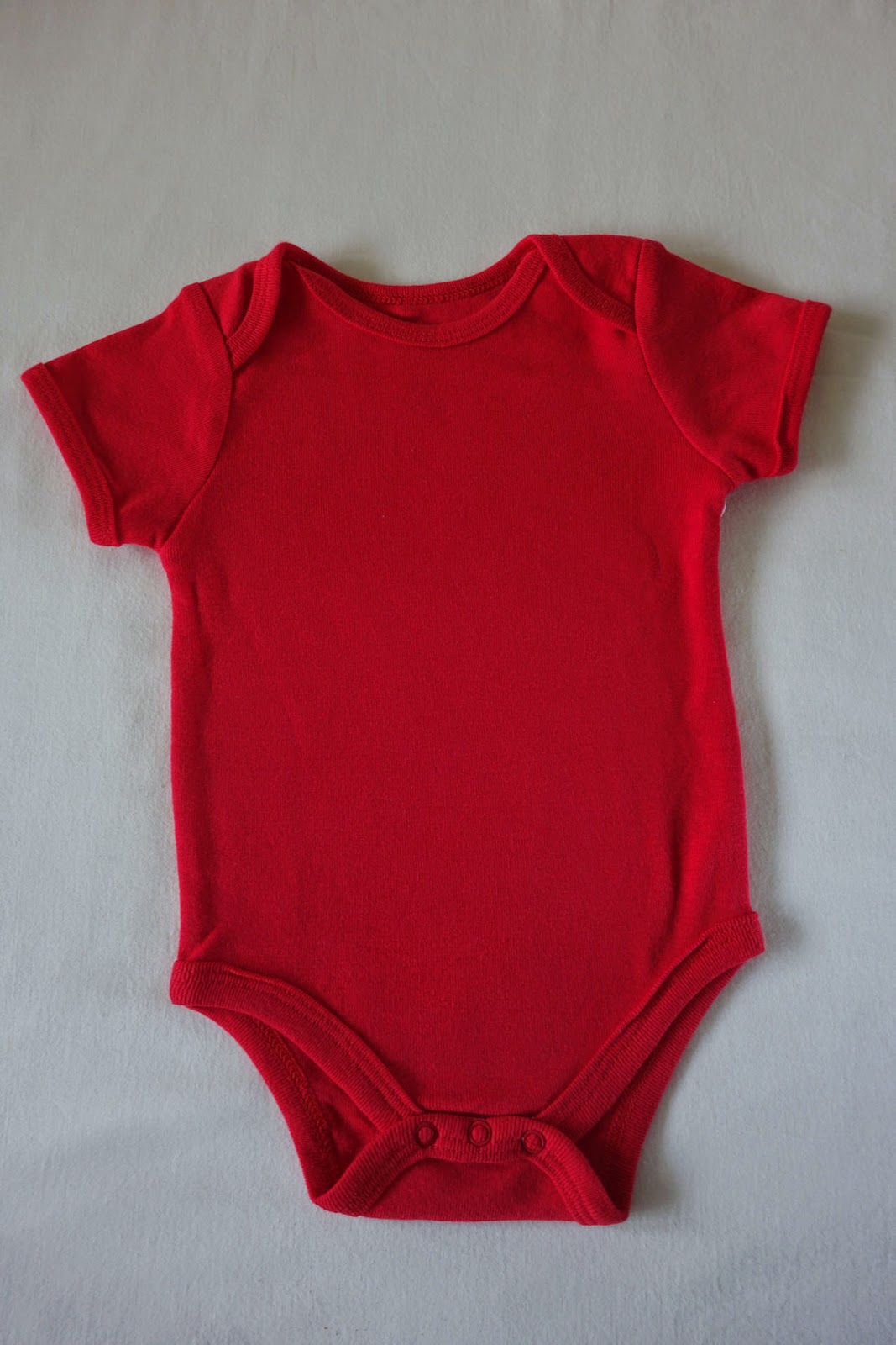 plain red baby bodysuit