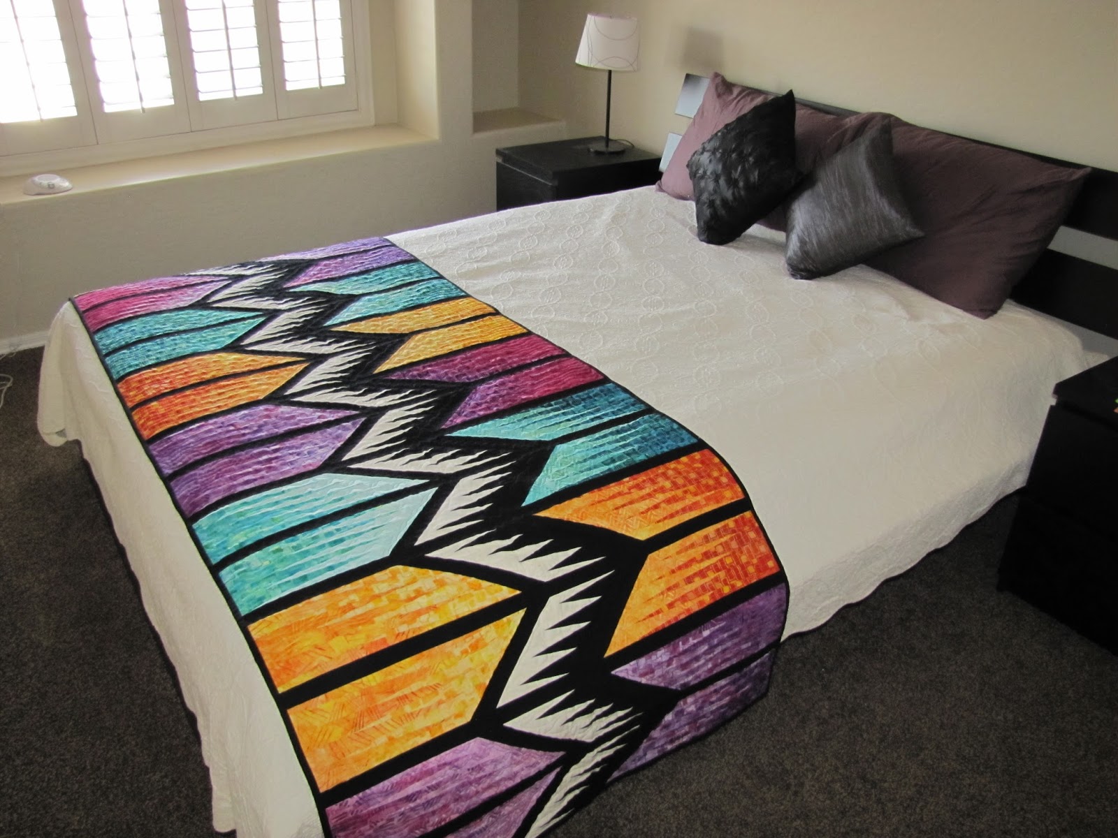 Canton Village Quilt Works Quilts on the Bed
