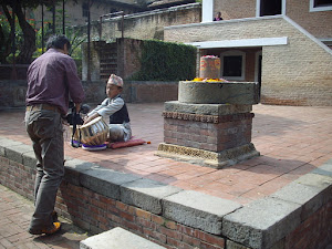 A child prodigy playing the tabla for telivision and media inside "Patan Darbar Square Museum".