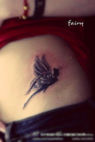 a cute small fairy tattoo on the hip