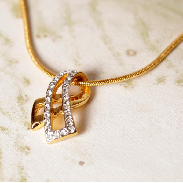 “Simplicity is the keynote of all true elegance.” Gold Pendants For Girls