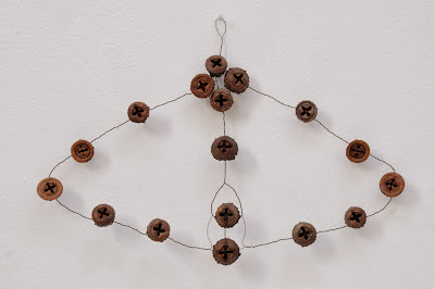 Seedline, 2012, wire, eucalyptus pods by Mari Andrews
