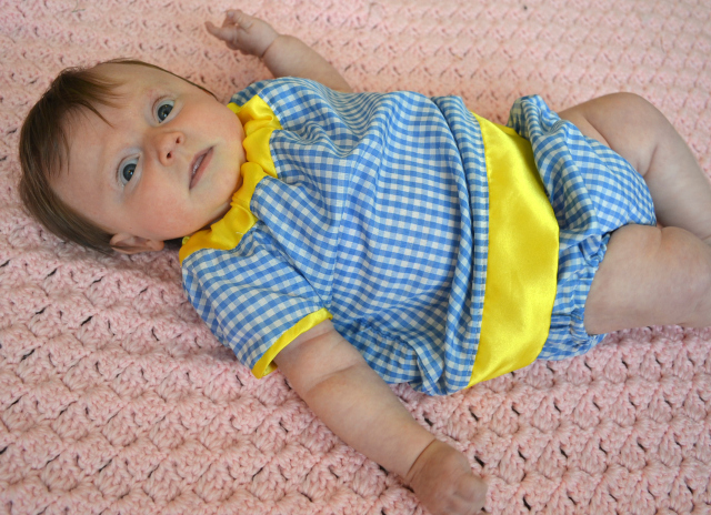 Baby clothed in summer