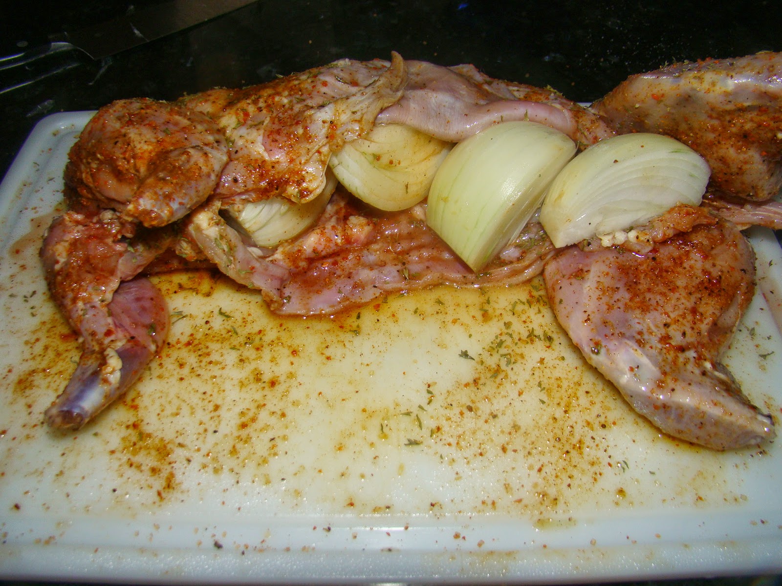 HRM CREATIVE BBQ Bacon wrapped Rotisserie Rabbit on the BBQ