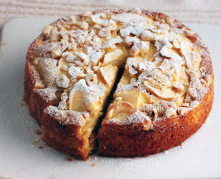 Apple, Pear and Hazelnut Cake: Classic fruited cake with semolina in the batter served with a wedge slightly extracted