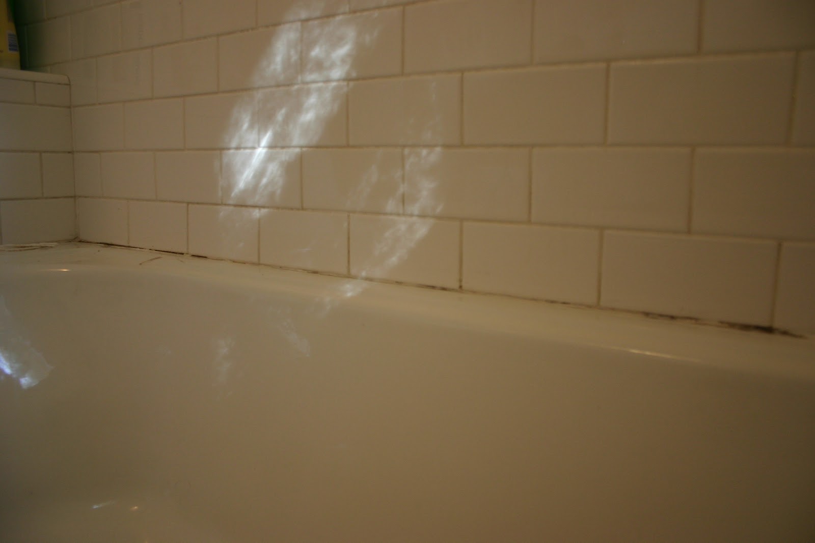 re caulking the bathtub The Gardener's Cottage