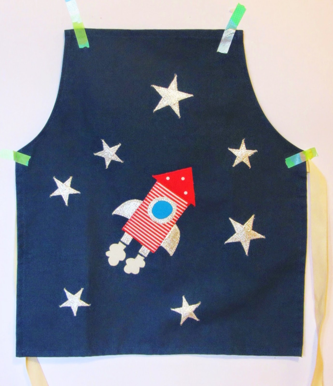 La sciarpa che canta: grembiuli da cucina con applique Applique bambini