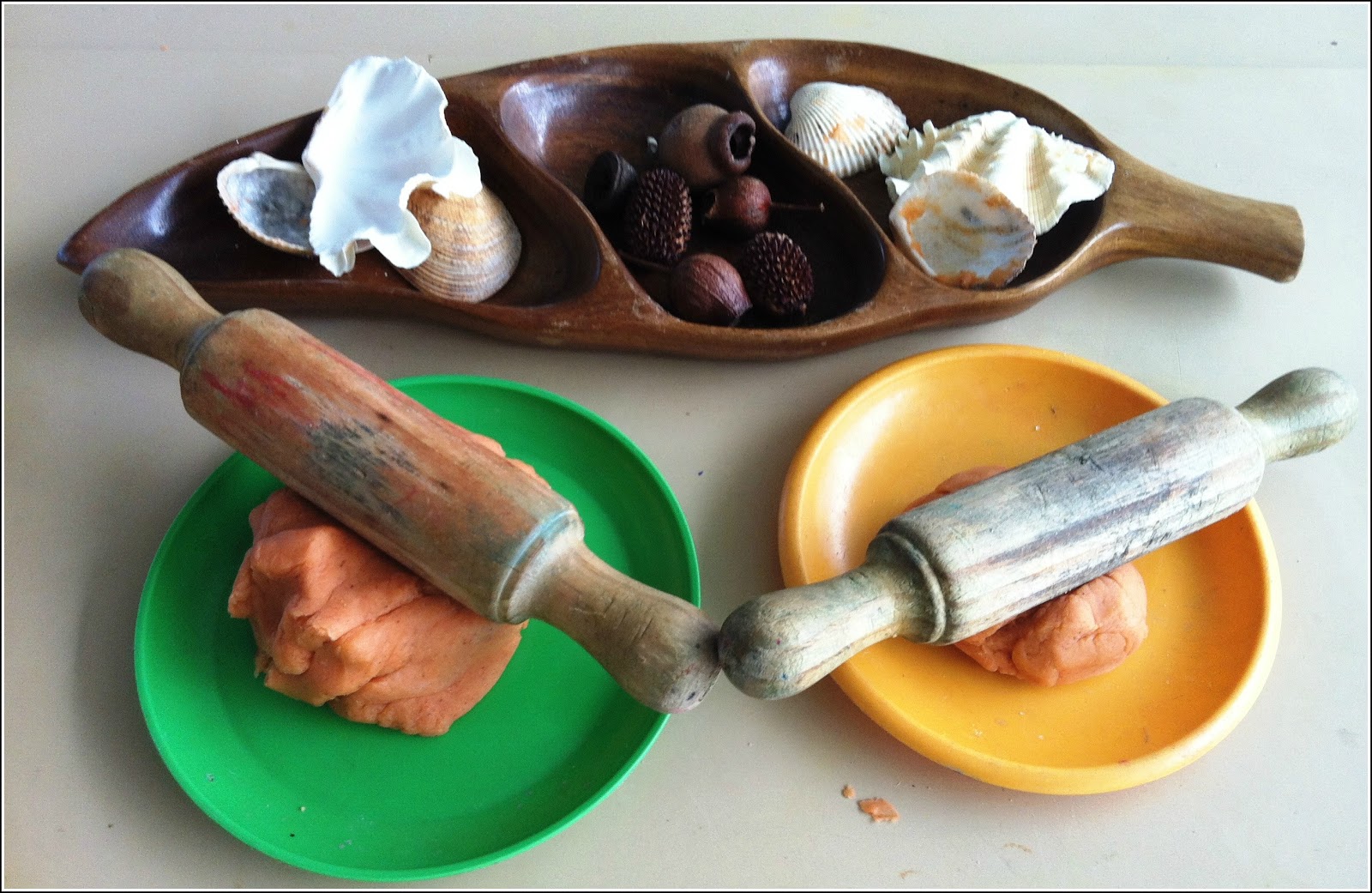 let the children play playdough and natural materials