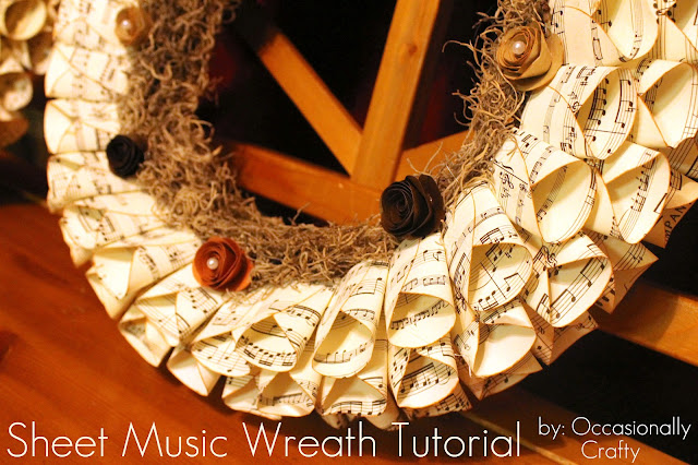 Wreath made from sheet music and wrapping paper. Glued together with hot  glue.