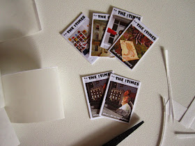 Dolls' house miniature versions of The tiny Times magazine.