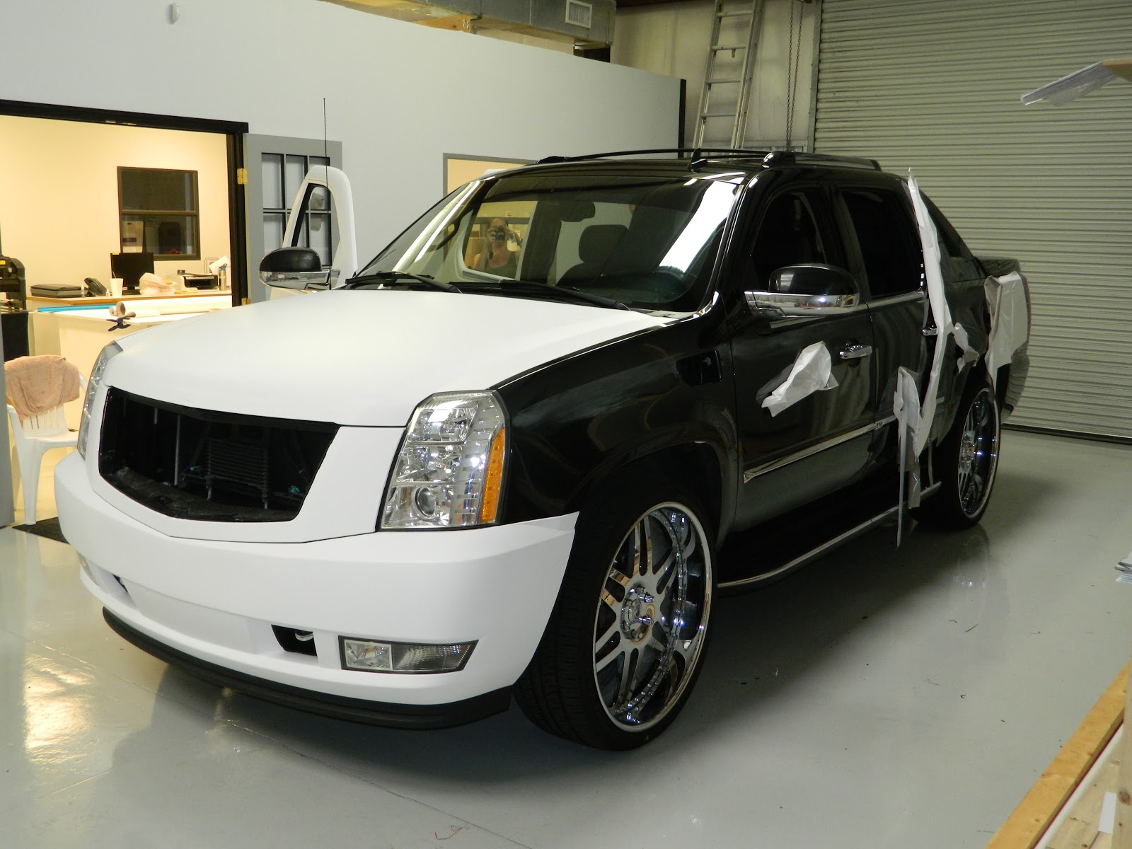 Laser Sharp Sign Design Black Escalade Wrapped in Stormtrooper White