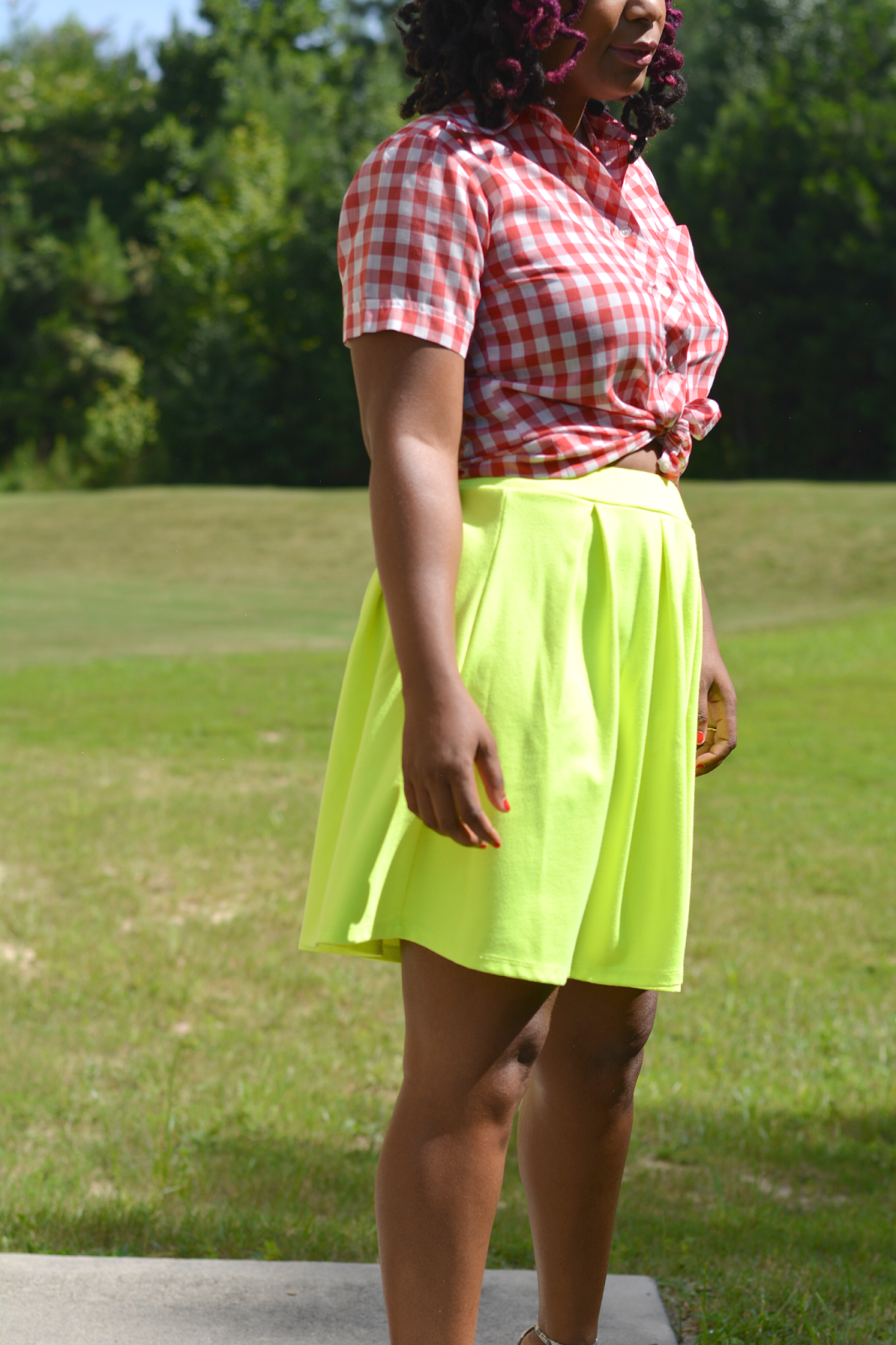 neon skirt worn with gingham