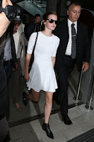   Emma Watson  leggy in a short white dress