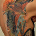 Flying phoenix tattoo on side body 