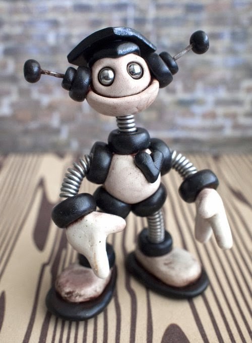 06-Mini-Graduation-HerArtSheLoves-Clay-Robot-World-Sculptures-www-designstack-co