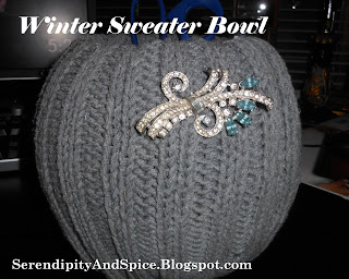 blog+023 Winter Sweater Bowl with Bling! It’s Whimsical Wednesday!</p> Okay, I swear this is the LAST crafty post about sweaters...I think.
I just can't help myself... I LOVE the cable knit sweater look during these winter months! If you missed my other Cable Knit Sweater Creations please check them out here, I think my all time favorite is still my turquoise lamp!  But this one is a close 2nd! I know, you probably recognize the broach from my lamp... I was playing around with different ideas...I think I'm going to HL to see if I can find some big blingy buttons. Oh, and do you notice something new about my photos?  I finally learned how to merge them together to make before and after shots and how to add my webpage on them- I learned this all by myself- aren't you proud! I'll be sharing how to do this on Friday in our I Heart Blogging series! Materials Needed:</p> Old Sweater</p> Bowl</p> Glue Gun</p> Glue Sticks</p> Bling!!!</p> Directions: 1. Measure and cut the sweater to fit around the bowl. <p>2. Use your glue gun and attach the sweater along the base of the bowl.
Note: Don't do it on the bottom or else your bowl won't sit flat.</p> 3. Tuck the extra sweater into the top of the bowl and glue it down. 4. Add some bling and you're done! Mine now sits on my desk and holds my pens and scissors. Do you have a favorite recipe or tutorial?  Share it at my Manic Monday Linky Party! Sharing at:
Make It Yourself Monday