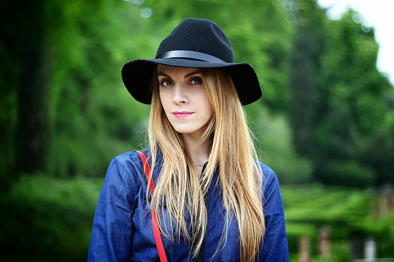 leather and denim denim shirt, red crossbody bag, fedora