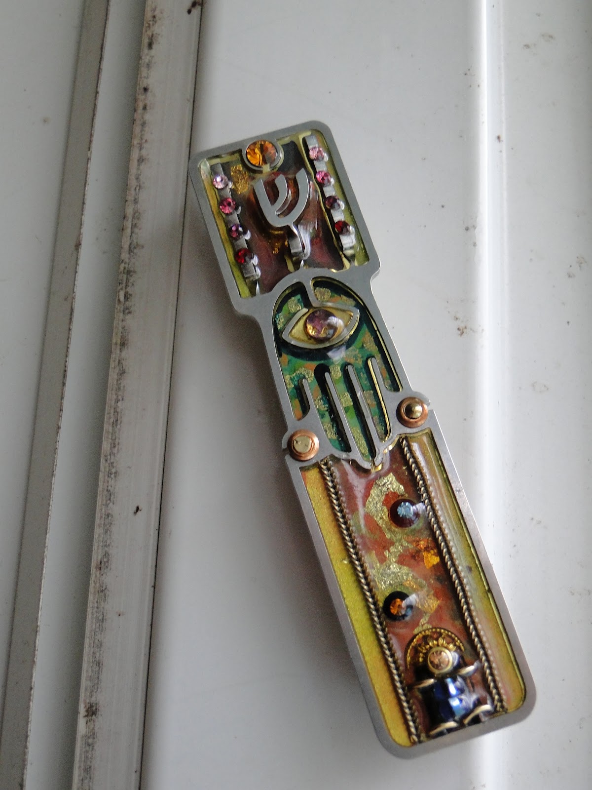 a single feather mezuzahs