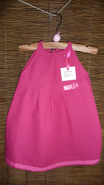 robe "coccinelle" en coton rose "bonbon" avec ses pois et son ruban