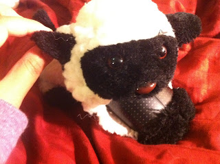 Microsoft TouchMouse inside a cute white and black toy sheep
