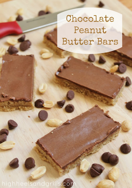 Chocolate Peanut Butter Bars cut up and spaced out on a cutting board.