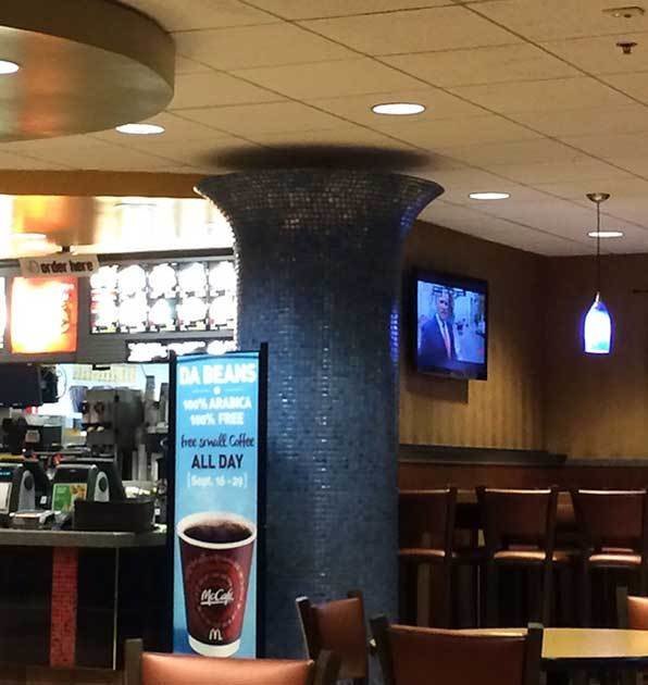 At a McDonald's restaurant. What does this post hold up? What about that gap?