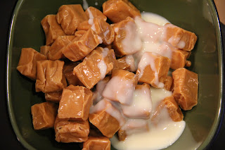unwrapped caramel and milk in a bowl