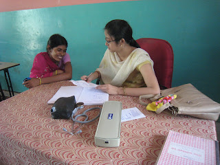 Two women writing at the table