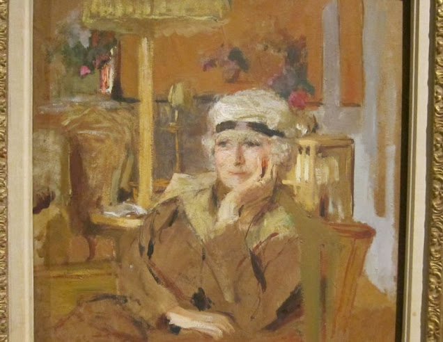 Portrait of seated woman in tan colors