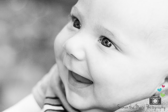 black and white of baby smiling